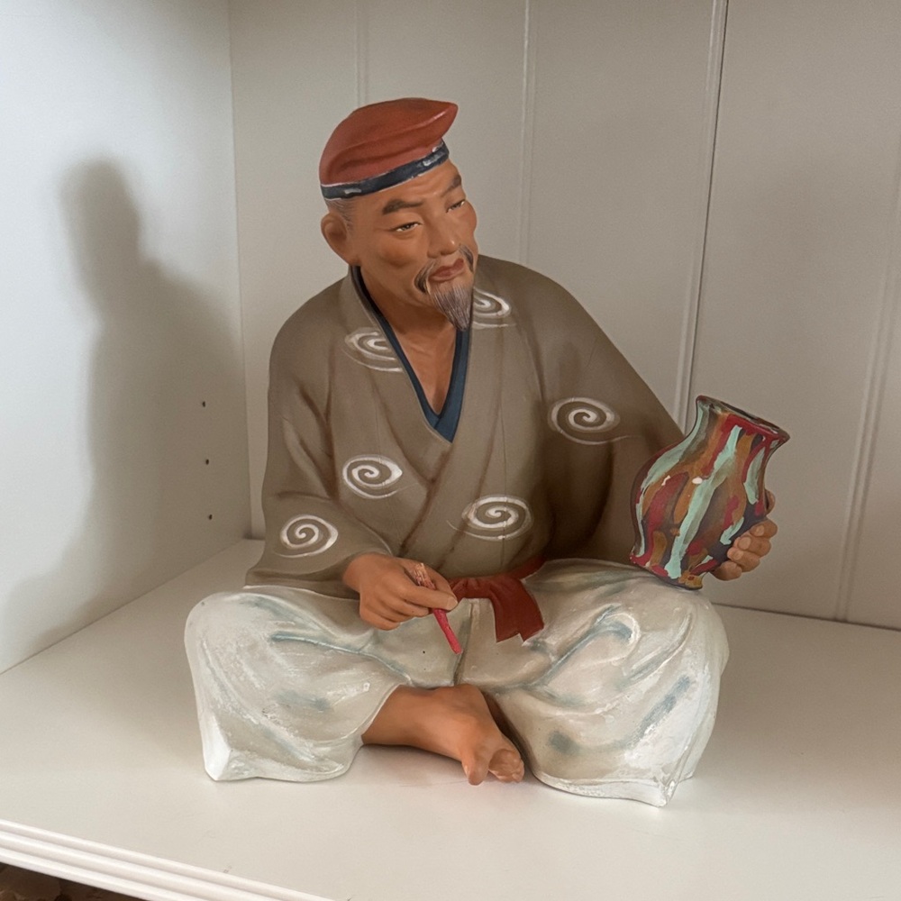 Ceramic Figurine with Colorful Vase
